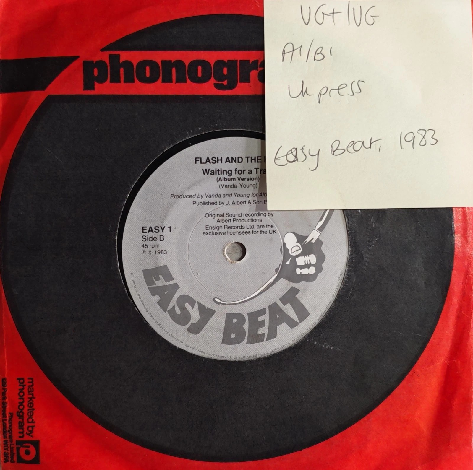 Flash And The Pan Waiting For A Train Vinyl Record 7" VG+/VG EASY1 1983 sleeve Flash And The Pan Waiting For A Train Vinyl Record 7" VG+/VG EASY1 1983 sleeve
