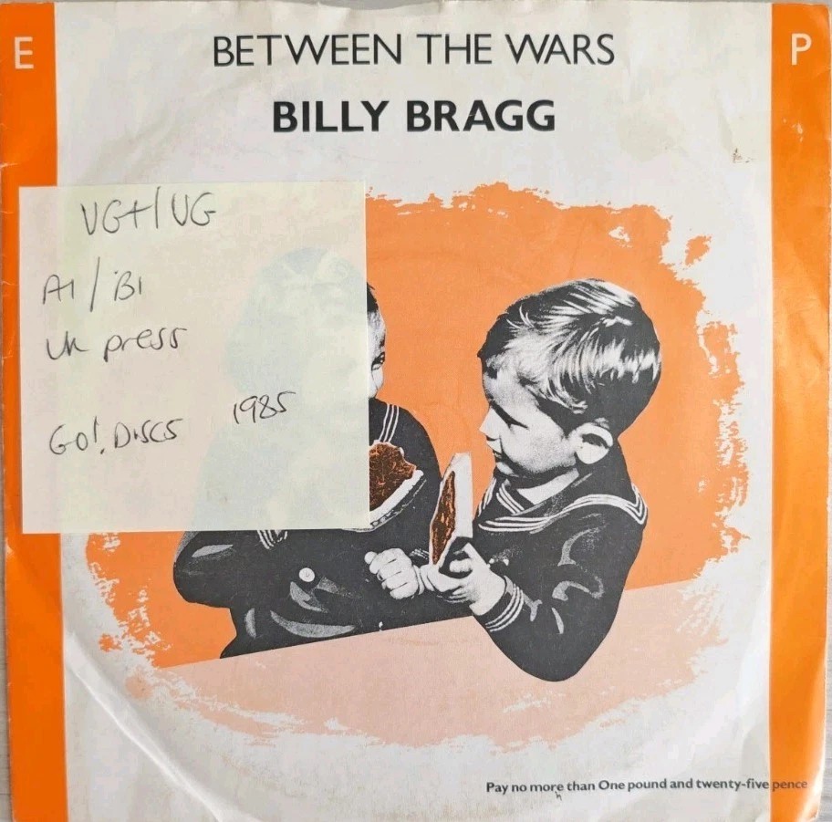 Billy Bragg Between The Wars EP Vinyl Record 7" VG+/VG AGOEP1 1985 sleeve Billy Bragg Between The Wars EP Vinyl Record 7" VG+/VG AGOEP1 1985 sleeve