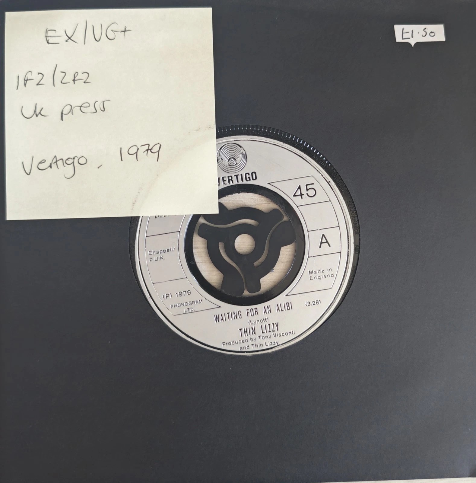 Thin Lizzy Waiting For An Alibi / With Love Vinyl Record 7" EX/VG+ LIZZY003 1979 vinyl record sleeve Thin Lizzy Waiting For An Alibi / With Love Vinyl Record 7" EX/VG+ LIZZY003 1979 vinyl record sleeve
