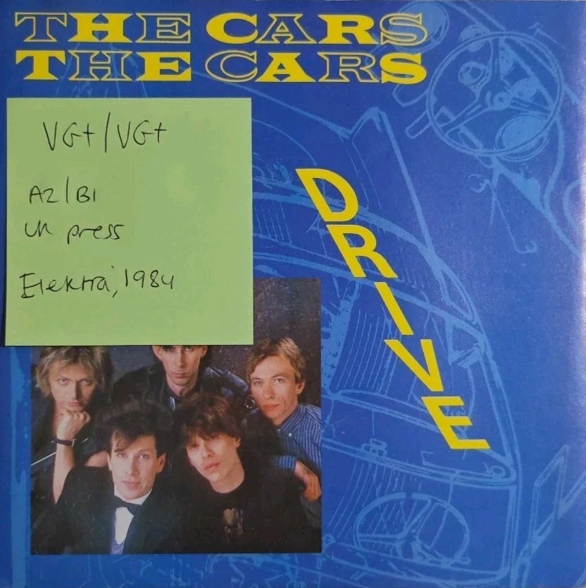 The Cars Drive / Stranger Eyes Vinyl Record 7" VG+/VG+ E9706 1984 sleeve The Cars Drive / Stranger Eyes Vinyl Record 7" VG+/VG+ E9706 1984 sleeve