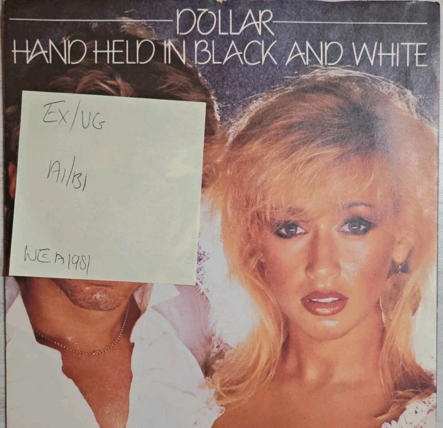 Dollar Hand Held In Black And White Vinyl Record 7" EX/VG BUCK1 1981 sleeve Dollar Hand Held In Black And White Vinyl Record 7" EX/VG BUCK1 1981 sleeve