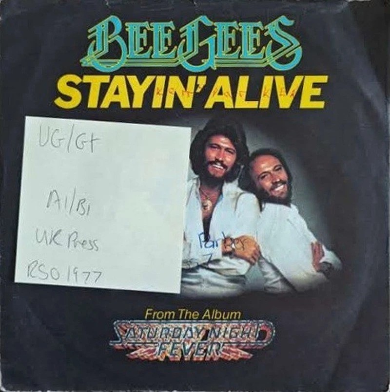 Bee Gees Stayin' Alive Vinyl Record 7" VG/G+ 2090 267 1977 sleeve Bee Gees Stayin' Alive Vinyl Record 7" VG/G+ 2090 267 1977 sleeve