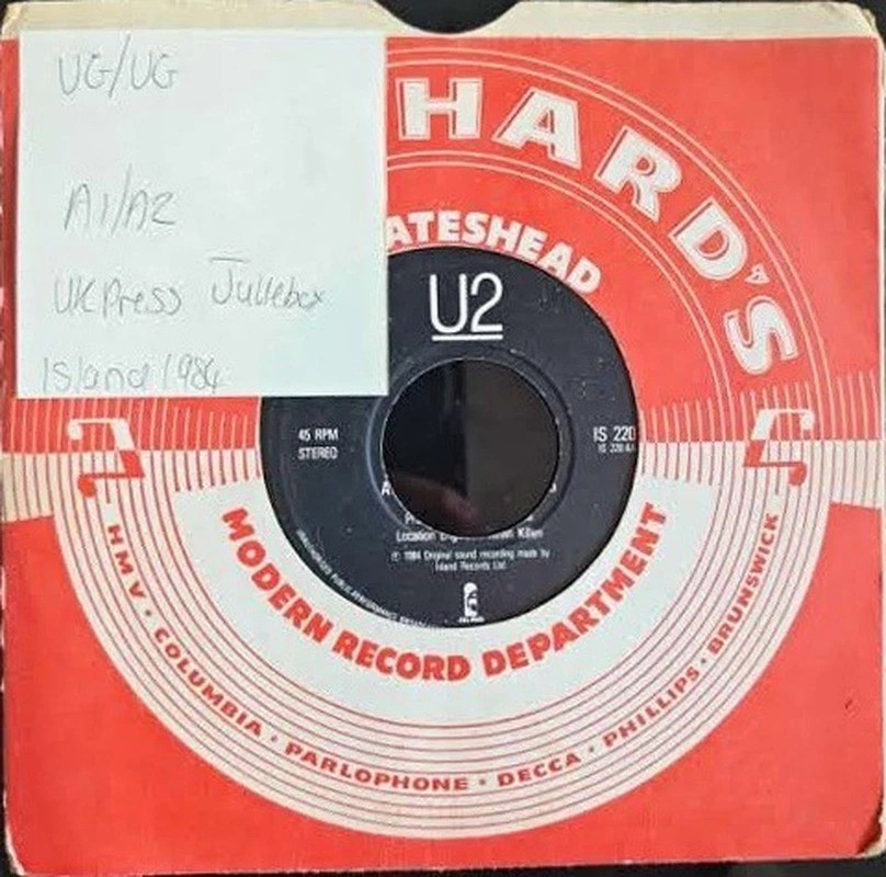 U2 The Unforgettable Fire Vinyl Record 7" VG/VG IS 220 1985 sleeve U2 The Unforgettable Fire Vinyl Record 7" VG/VG IS 220 1985 sleeve