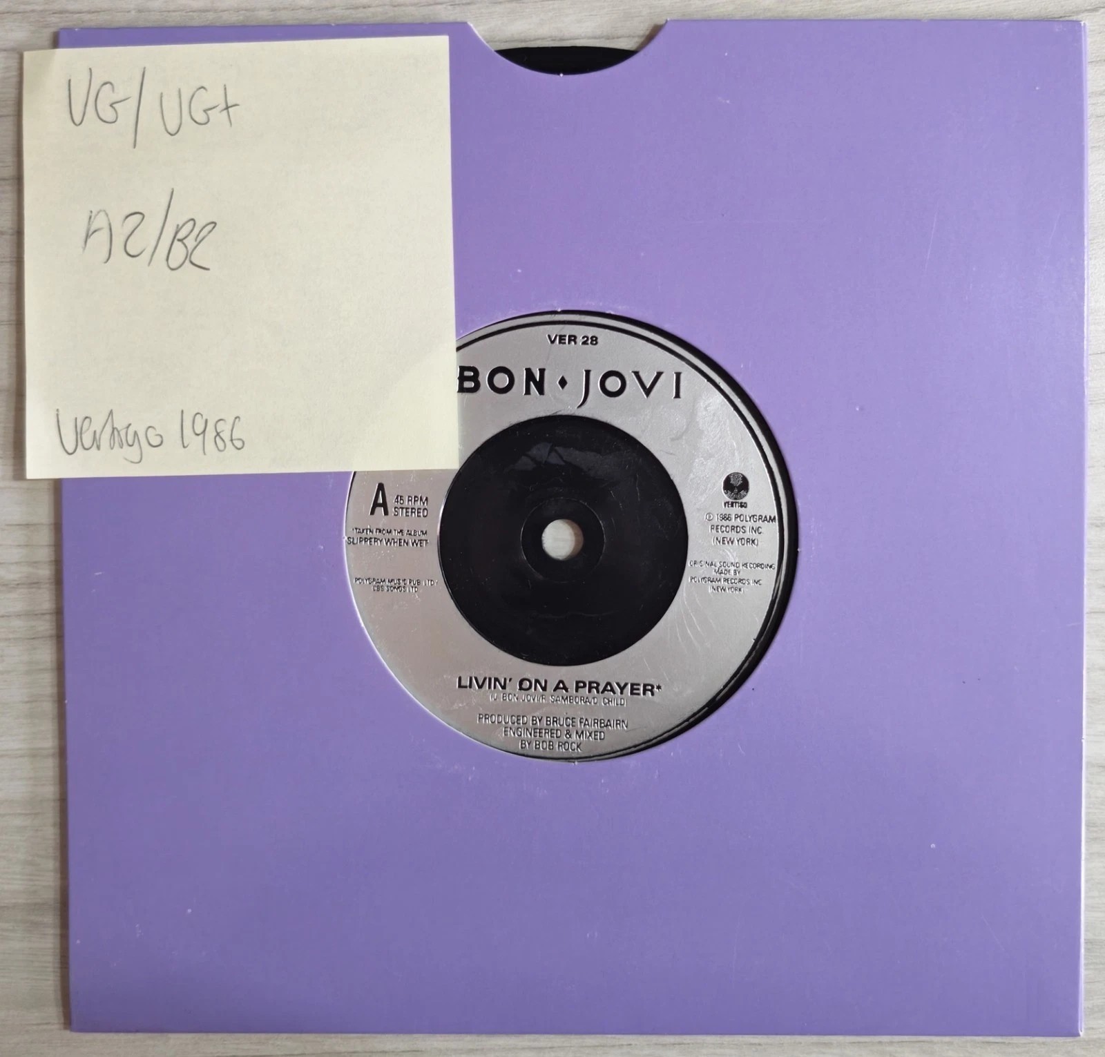 Bon Jovi Livin' On A Prayer Vinyl Record 7" VG/VG+ VER 28 1986 vinyl record sleeve Bon Jovi Livin' On A Prayer Vinyl Record 7" VG/VG+ VER 28 1986 vinyl record sleeve